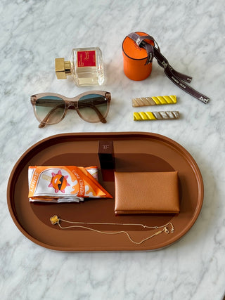 Rhapsody Brown vanity tray flat lay with scarf, wallet and jewelry