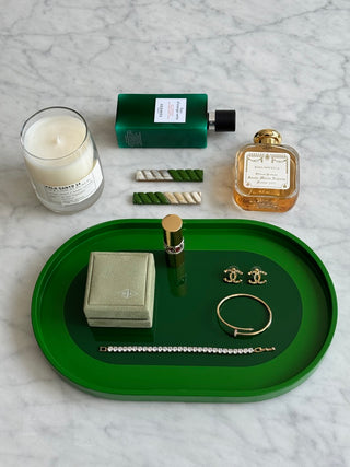 Rhapsody Green vanity tray flat lay with jewelry, candle and perfume